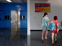1009397793 ma nb HayMacFistDay  A teacher walks a student to class on the first day of school at the Hayden McFadden Elementary School in New Bedford.  PETER PEREIRA/THE STANDARD-TIMES/SCMG : education, school, students